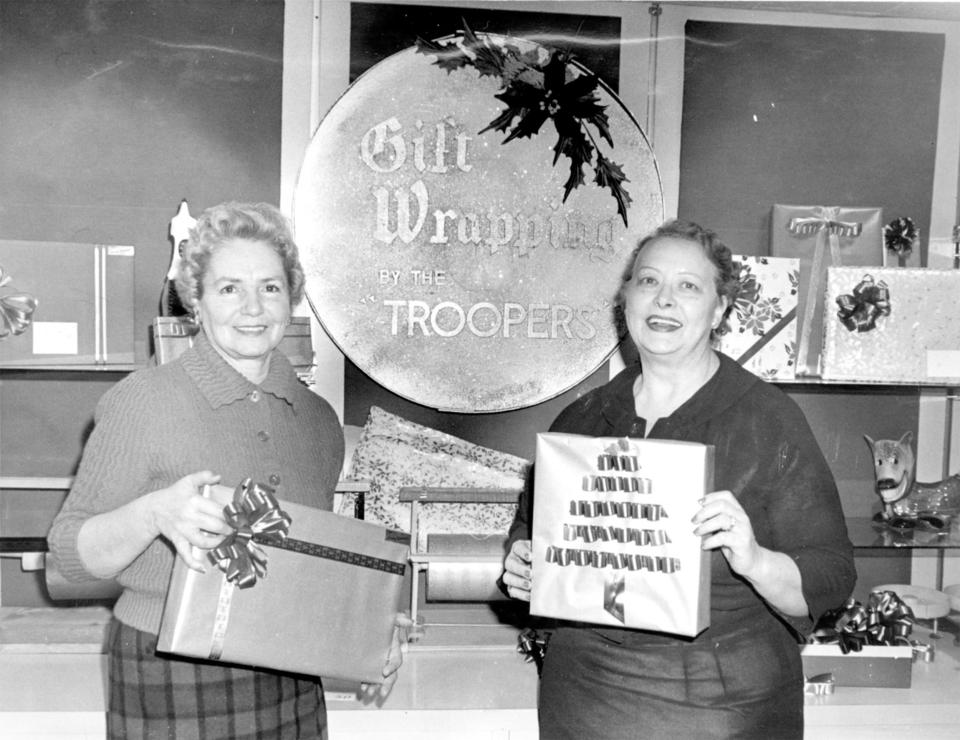 Kathleen Smith, left, helped start the Christmastime gift-wapping tradition, a fundraiser, at Harry Yessness men’s store in Casper around 1960. Troopers Archives #1791.