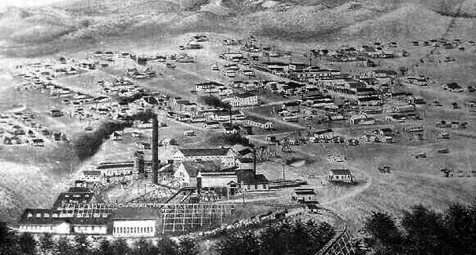 Encampment, Wyo., about 1903, with the copper smelter in the foreground and the ore-bearing aerial tramway rising to the right. Courtesy Wyoming Tales and Trails.