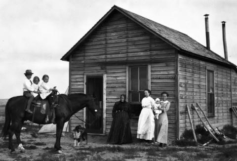 The Holmberg family in 1912, six years after Indian lands north of Wind River were opened to homesteaders. Riverton Museum.