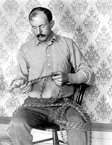 Tom Horn braiding rope in the office of the Cheyenne Jail, 1902. Wyoming State Archives.