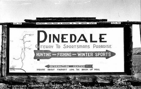 This sign from the 1940s touts Pinedale as the &quot;farthest town from a railroad in the United States.&quot; Wyoming Tales and Trails.