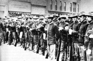 Federal troops, shown here on Front Street in 1885, stayed in Rock Springs for 13 years. Wyoming Tales and Trails photo. 