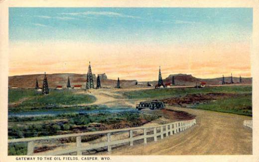 The Salt Creek oil field in the 1920s. Teapot Dome is the arched butte on the left. Wyoming Tales and Trails.