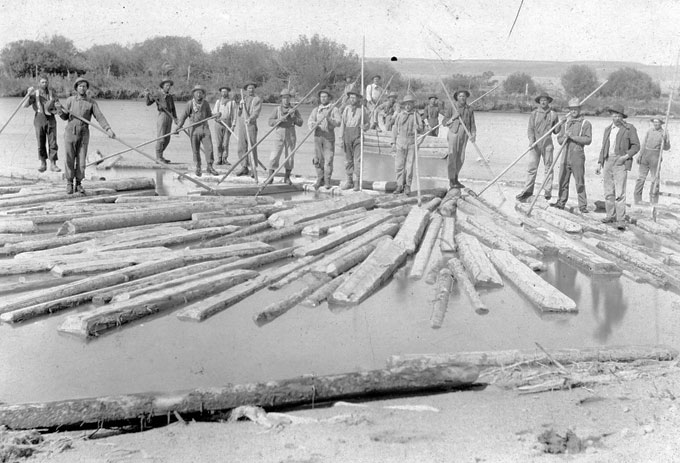 Tie-hacks, mostly from Sweden, Norway, Finland and Austria, were also called river rats and and were paid well for their dangerous  work. They are shown here with pike poles, moving ties down the Green River in the 1890s. Bill and Carrie Budd photo, Thelma Budd collection.