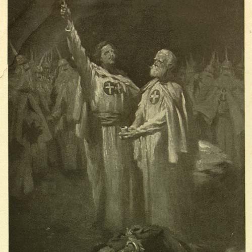 Illustration of two white men in Klan robes, the younger holding a cross in flames, with the caption "The Fiery Cross of old Scotland's hills!"