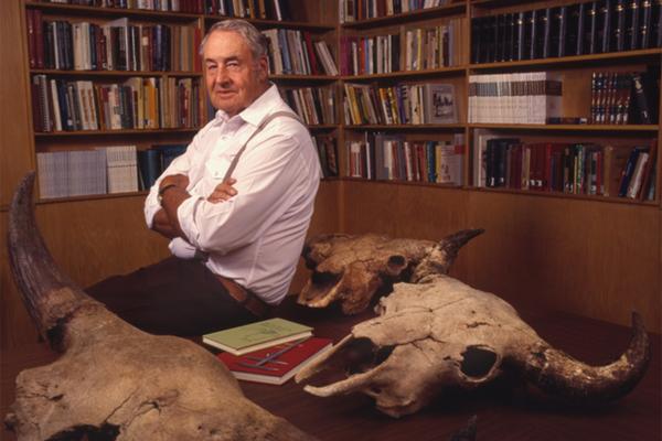 George Frison in his office with ancient bison skulls, late in his career. He was elected to the National Academy of Sciences in 1997. Ted Brummond, UW photo service. 