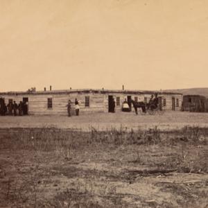 Brown’s Hotel at Fort Laramie, 1868, where Gardner may have socialized. The man in the foreground may be Alexander Gardner himself. Sherman collection of Gardner photographs, NMAI.