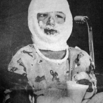 Ryan Taylor, 7, at the Montpelier, Idaho hospital after the Cokeville bombing. Casper Star-Tribune Collection, Casper College Western History Center.