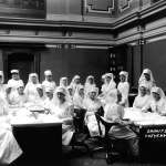 Red Cross nurses in the Senate chamber at the Wyoming Capitol in Cheyenne, ca. 1918. Joseph Schmitz photo, Wyoming State Archives. 