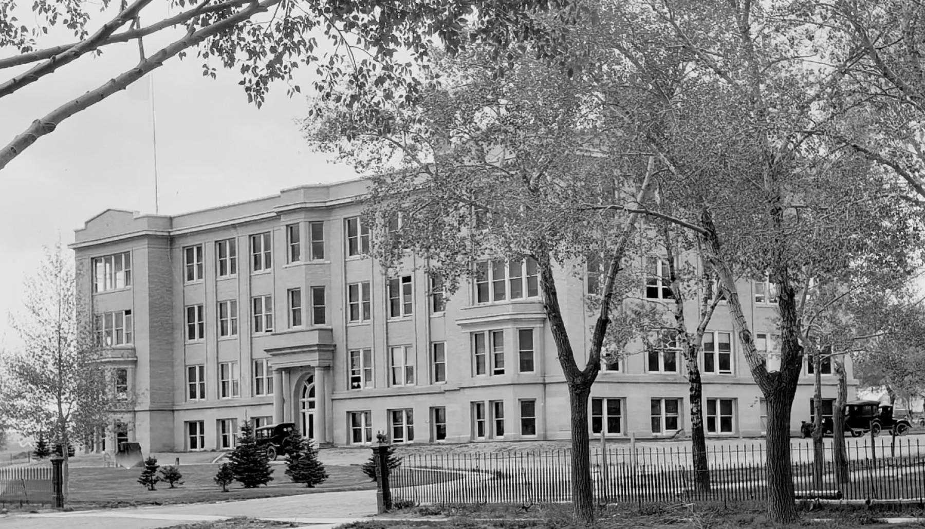 Agriculture College building, constructed in 1913 on the UW campus and the first building exclusively for the college. It later became the BioChem building and is now part of the Health Sciences Center. Large four-story brick building