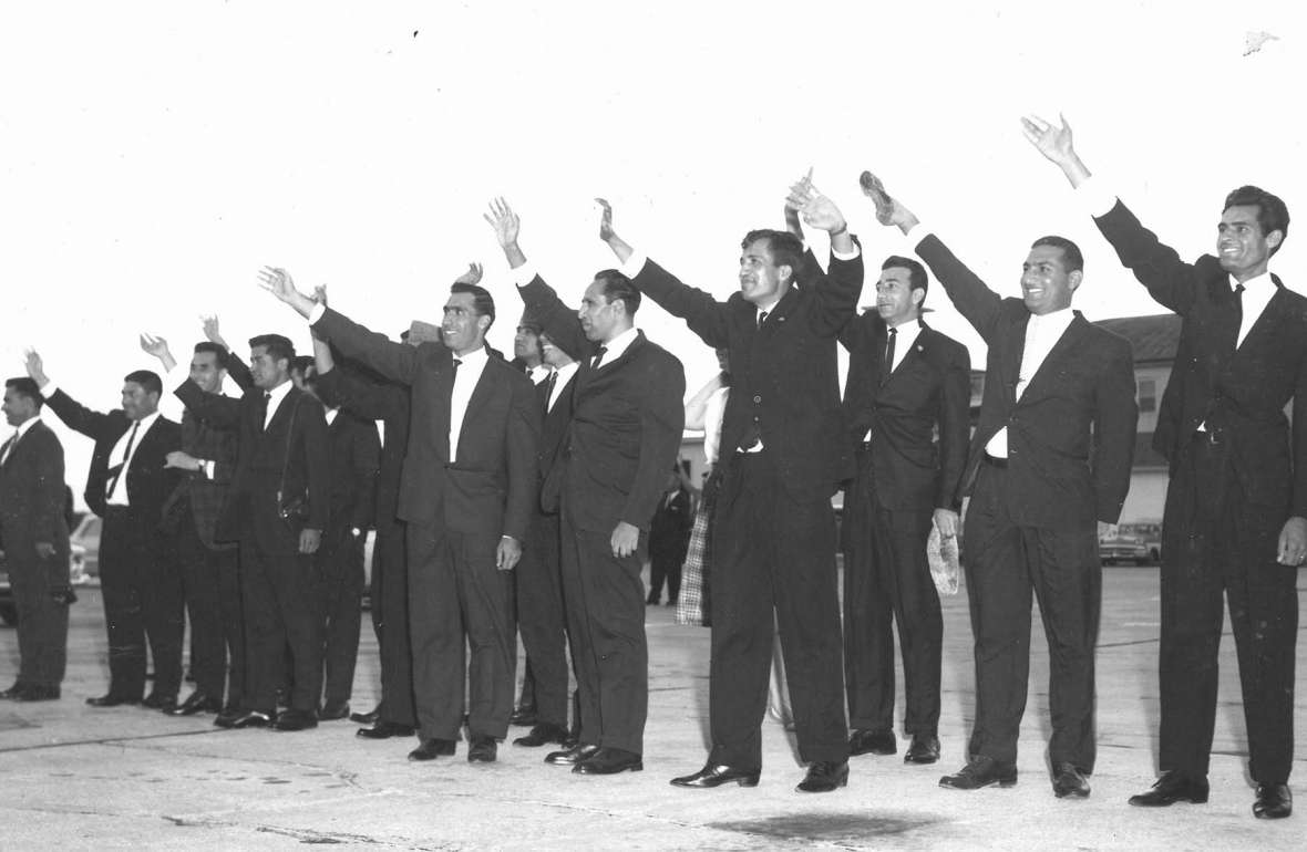 Afghan students enrolled in U.S. universities wave good-bye to their king and queen at the Cheyenne airport, September, 1963, as the royals start on the next leg of their tour that will take them to San Francisco. American Heritage Center.