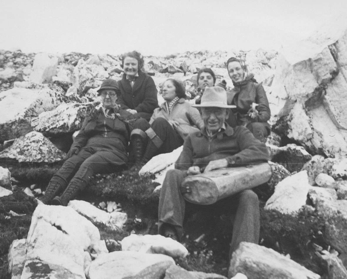 Aven Nelson and a few of his students, 1937. One student described him as 'part poet,' a 'great teacher' but an 'indifferent administrator.' Nelson is holding a vasculum, a container for carrying plant specimens from the field back to camp or the herbarium for pressing. American Heritage Center.