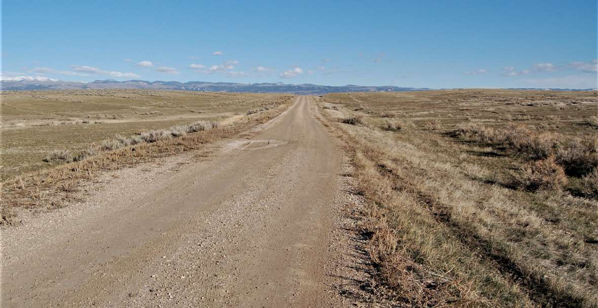 An auto tourist headed east on the Black and Yellow Trail west of Ten Sleep was afforded a sweeping view of the Bighorn Mountains. Authors photo,  2013.