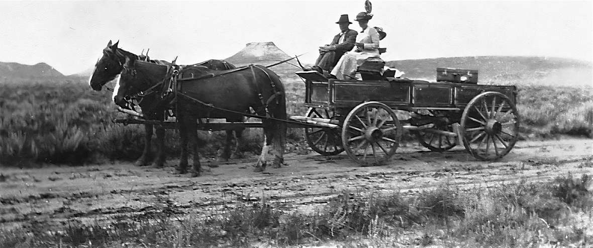 The Black and Yellow Trail in its early days: In about 1921, Frank Oedekoven and Bertha Shivers traveled the road in the vicinity of Rawhide Butte north of Gillette. Bertha’s sister-in-law, Emily Shivers, is in the back of the wagon. In spite of some reluctance on the part of Yellowstone personnel, the park opened its East Entrance to automobiles in 1916. This decision spurred the construction and improvement of roads that led to Yellowstone, such as the Black and Yellow Trail and the Yellowstone Highway; in turn the Park experienced an increase in tourism. Olin Oedekoven family.