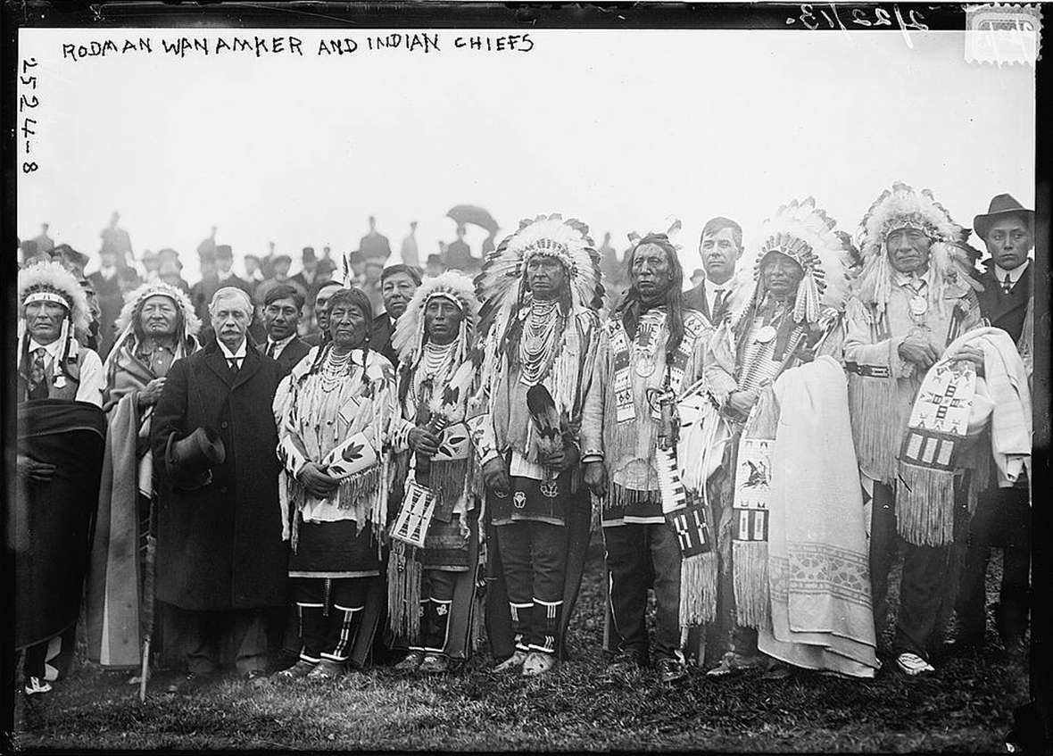 Around 30 American Indians from seven tribes joined Rodman Wanamaker, with top hat, at the groundbreaking for a planned National American Indian Memorial on Staten Island in New York City in 1913. Wikipedia.