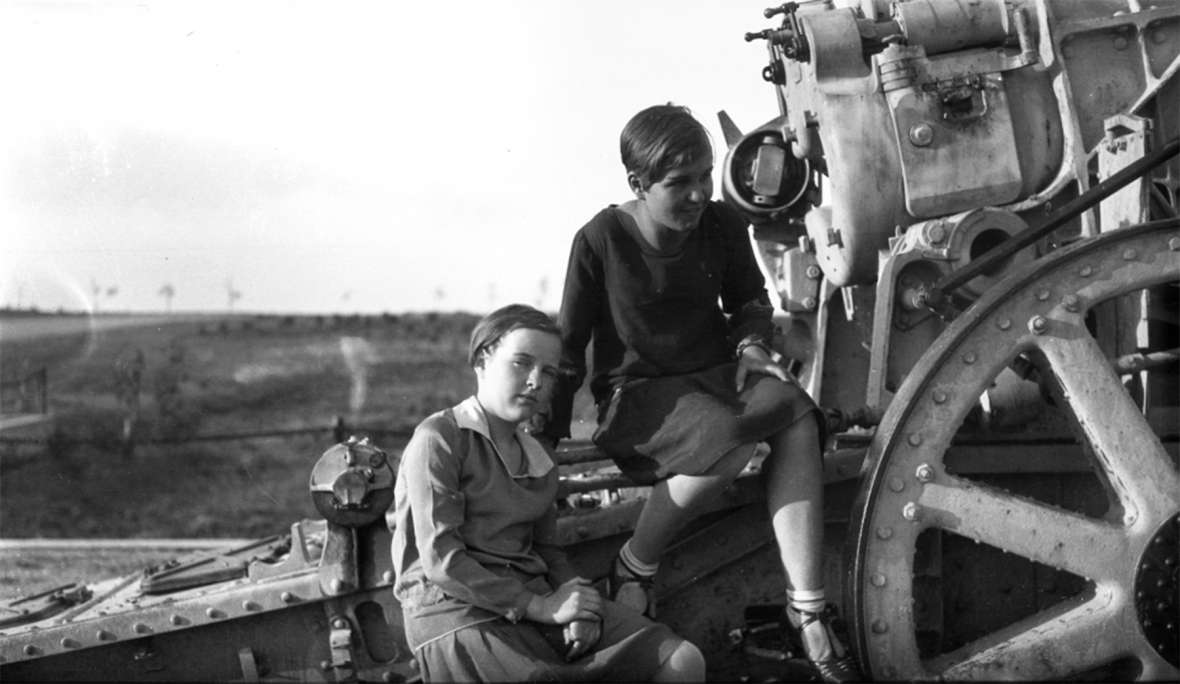 Two girls on a captured German howitzer in a park in Cheyenne, sometime after World War I. During World War II, state officials donated the guns to a scrap-metal drive, despite some local objections. Wyoming State Archives.