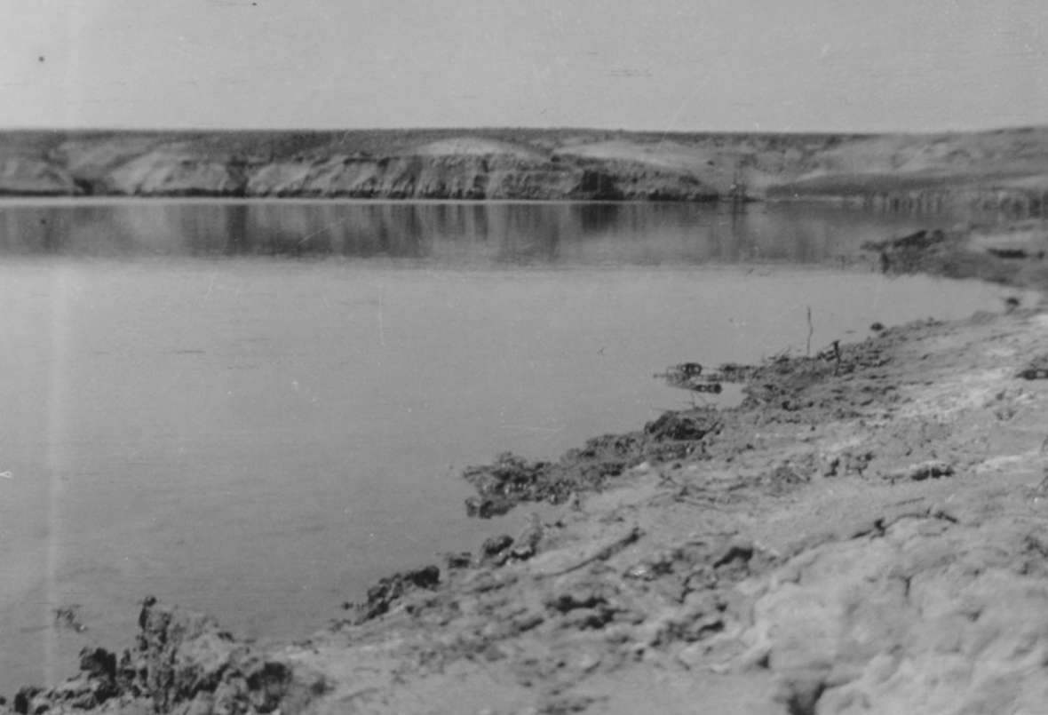 The larger of two irrigation reservoirs on the Love ranch, 1913. A few months after the dam was finished, a hailstorm so strained it that it broke. The flood ruined most of the crops. Love family photo.