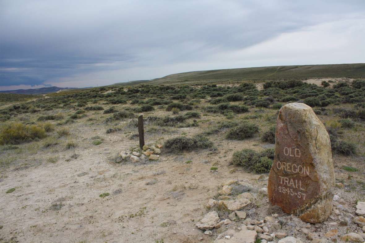 Ezra Meeker's marker remains today at the spot where the Oregon Trail, at left, crosses South Pass. Tom Rea photo.