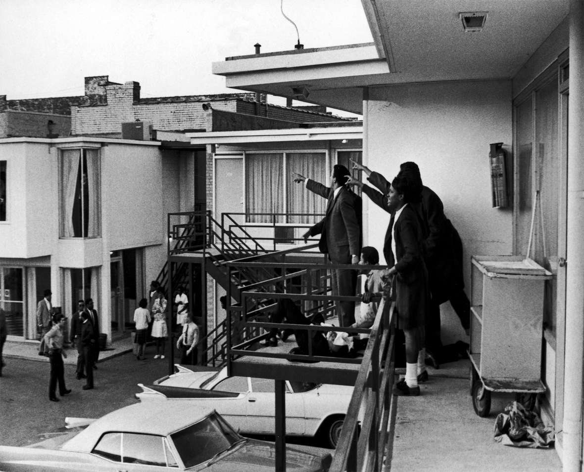 From the balcony of the Loraine Motel in Memphis, the Rev. Martin Luther King’s closest advisors point to the window where the deadly shot came from, April 4, 1968. The motel is now part of the National Civil Rights Museum. Getty Images.