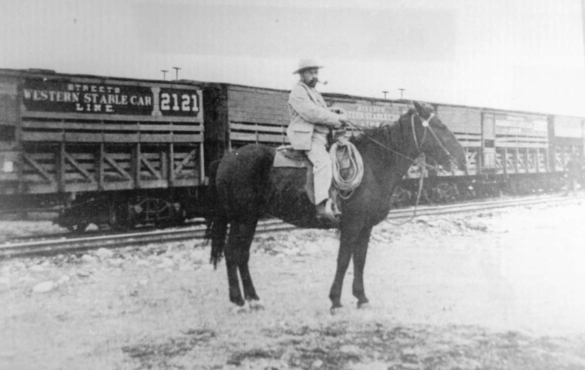 Franc at the railroad depot in Huntley, Mont., just east of Billings. He had an agreement with the Crow Tribe that allowed hims to graze Pitchfork cattle on the reservation most of the summer as they moved from the Bighorn Basin slowly north to the railhead. Courtesy of the Meeteetse Museums.