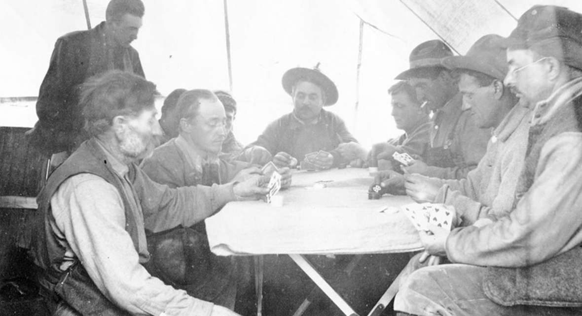 In hunting camp, Charles Gates—at the head of the table—and his posse played poker as if they were the finest casinos. Park County Archives. 