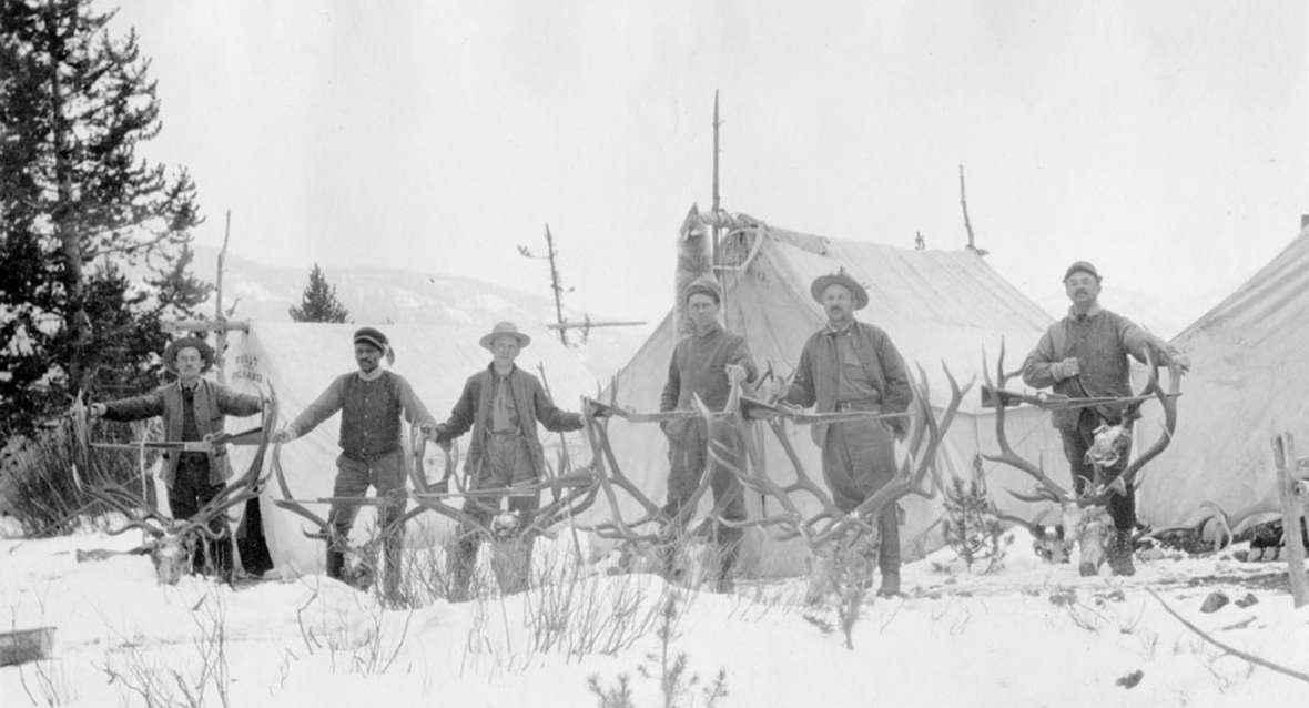 Charles Gates, second from right, and other hunters with their trophies during their 1913 trip. Altogether they bagged 10 bull elk and three mule deer in their month in the wilderness. Park County Archives.