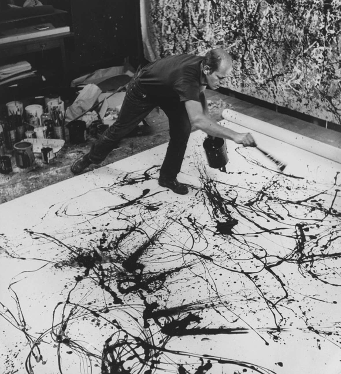 The artist at work in his studio, 1950. In Pollock's great works, you can’t look at a figure, or a form, or even a deeper meaning—so you’re free to focus on the artistic wonder of a line itself. Hans Nelmuth photo, National Portrait Gallery.
