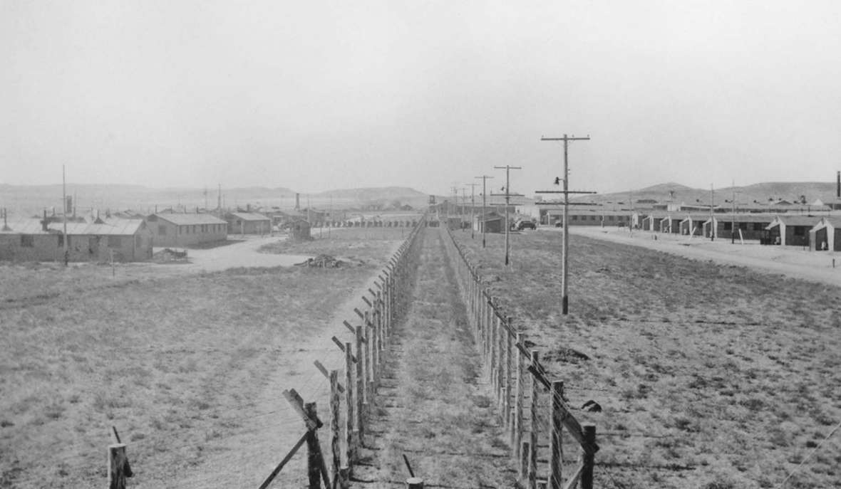 At Camp Douglas, a German noncommissioned officer was found hiding in the attic of an old camp building, reportedly hiding from pro-Nazi camp leaders. Afterward, the Army paid closer attention to security, installing double fences around the compounds and using guard dogs. Wyoming State Archives.
