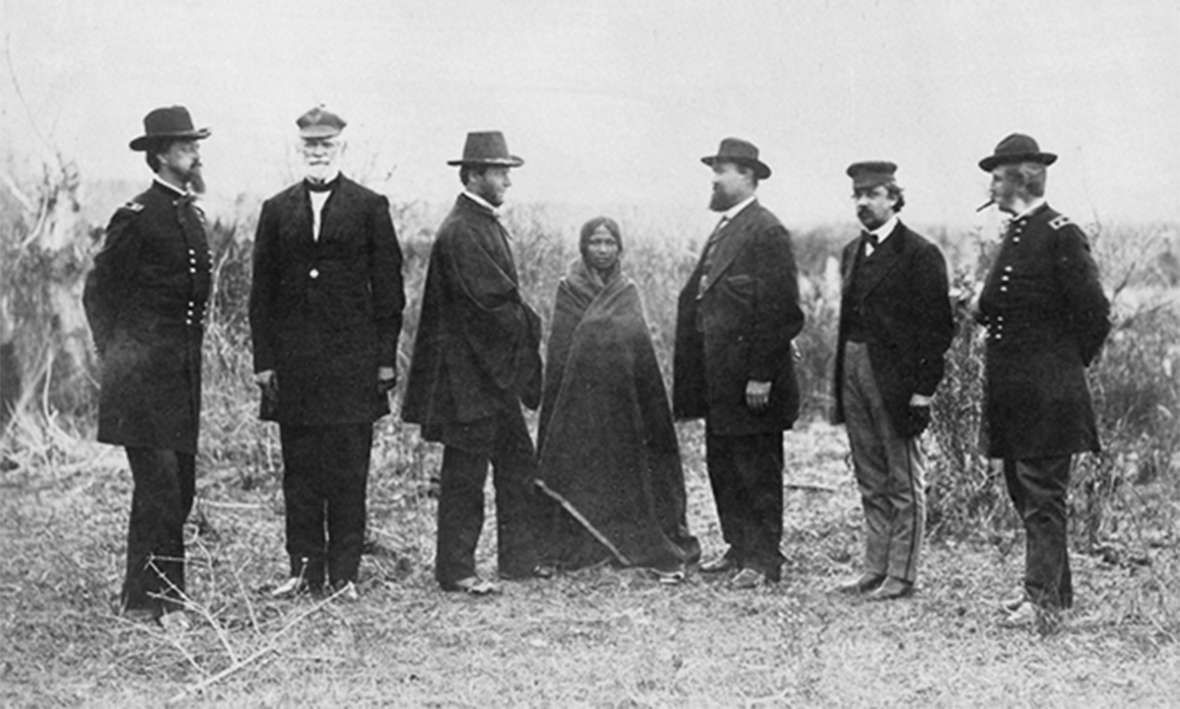 Sophia Mousseau, center, daughter of a French-speaking trader and an Oglala woman, was a girl when she interpreted for the peace commissioners at the Fort Laramie Treaty of 1868. By 1876 she was the common-law wife of Posey Ryan; together they had five children before he left her for Mary Ellen Clouser. Smithsonian Institute.