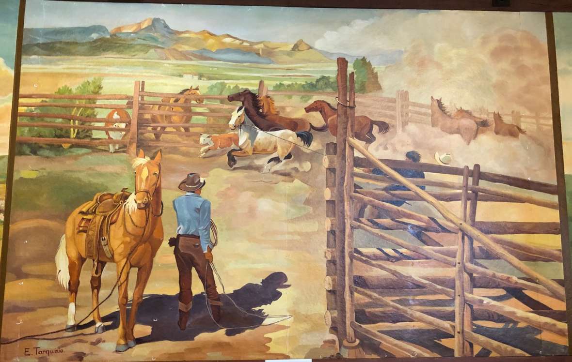 One of several western-themed murals by Italian POW Enzo Tarquinio painted in 1943-44 at the Camp Douglas officers’ club, Douglas, Wyo. Tarquinio and two other prisoner-artists used pictures by William Henry Jackson and Charlie Russell as starting points, but added some very Italian touches. Laura E. Ruberto photo. Click to enlarge.