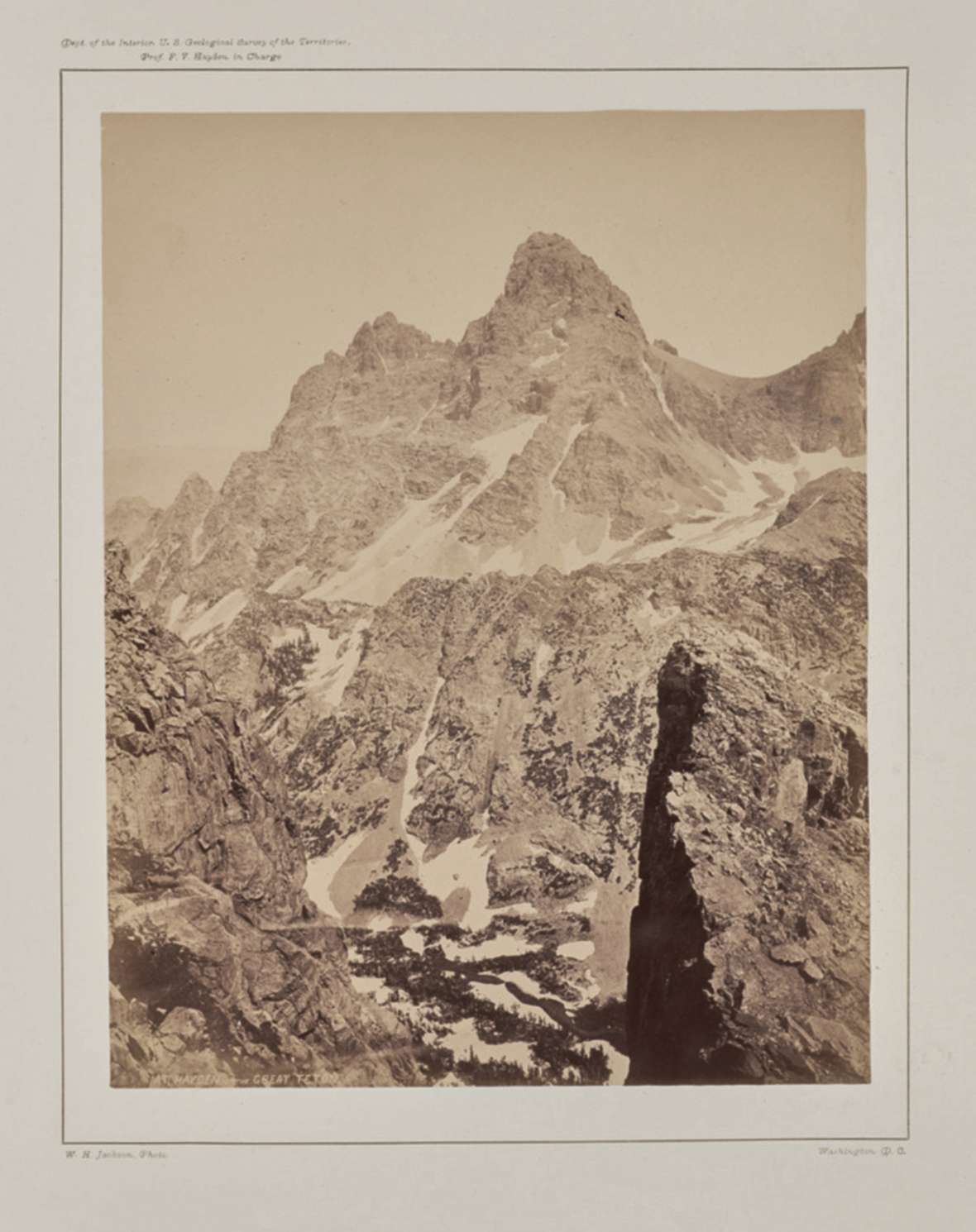 The Grand Teton from the top of Table Mountain on the Idaho side, by Hayden Expedition photographer William H. Jackson, August 1872. Note the absence of snow above the Lower Saddle at the right. Getty Museum.