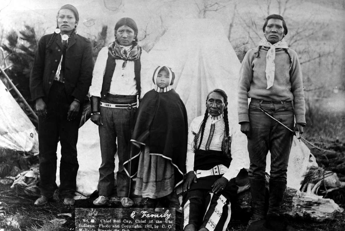 Red Cap, seated, may have been the most militant of the leaders of the White River Utes, and in 1906 was often named in newspapers. He poses here with members of his family in South Dakota near Fort Meade in 1907. C.C. McBride photo, Utah State Historical Society.