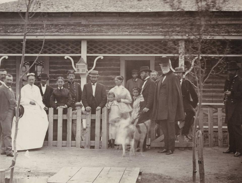 Ulysses S. Grant, in light colored hat with his hand on the fence, visits Fort Sanders south of Laramie, July, 1868. He was elected president the following November. Wikimedia.