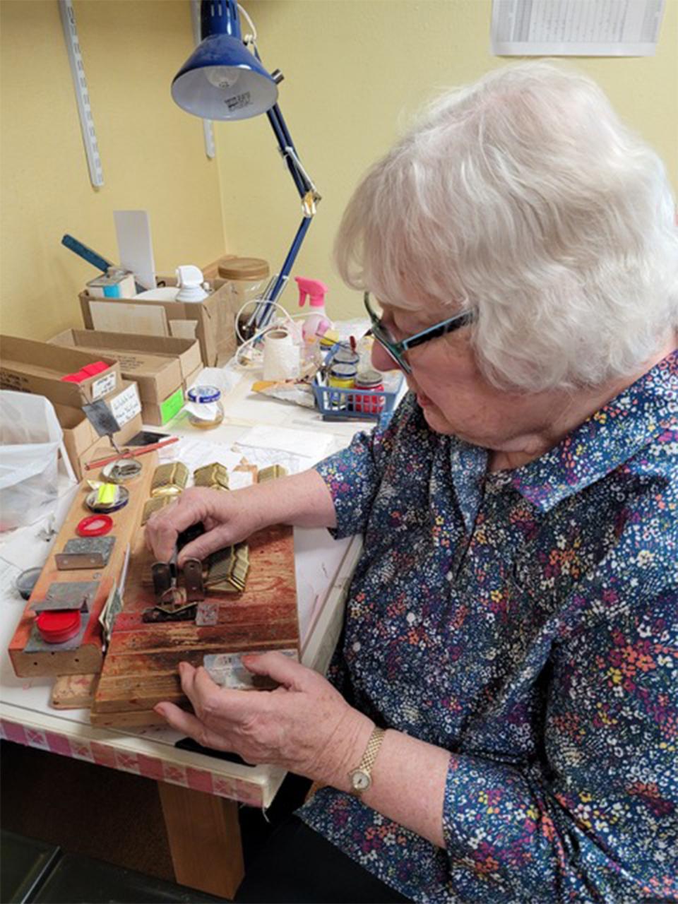 Susie Jacobson, daughter of the founder of Jakes Lures, still hand paints the dots the old-fashioned way on the firm's Wobbler because of the shape of the lure. Author photo.