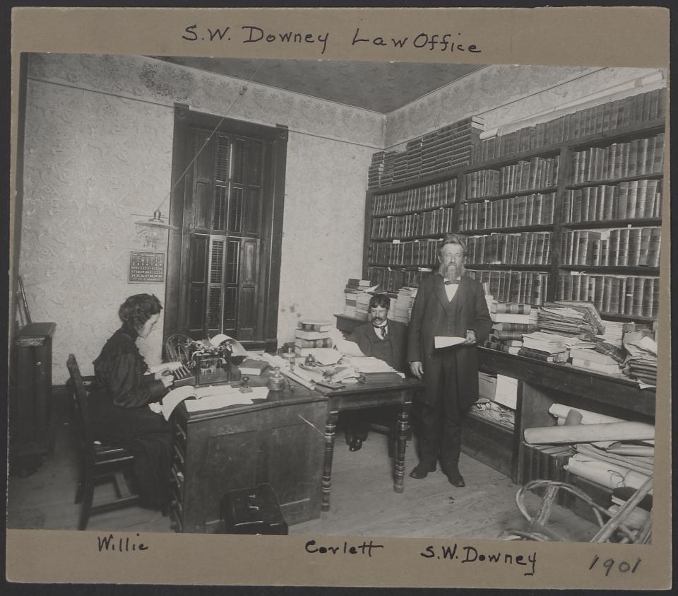 Laramie attorney and University of Wyoming founder Stephen Downey in his law office in Laramie, 1901, with his son and law partner, Corlett Downey, and his daughter, Willie, at the typewriter. American Heritage Center.