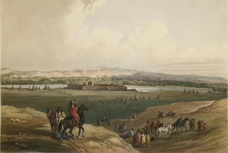 Painting of a plains landscape, with Indigenous people on foot and horses in the foreground, teepees scattered around a walled fort in the middle distance, by a body of water, and mountains on the horizon