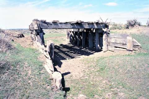 Remains of a wood timber bridge were found in 2002 along the earliest route of the Black and Yellow Trail, near present-day State Route 113 in Keyhole State Park before it was rerouted to the north in the late 1910s—so that tourists could more easily visit Devil’s Tower. Authors photo, 2002.  