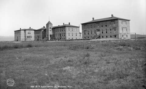 A U.S. government boarding school was completed near Fort Washakie in 1892 and nicknamed “Gravy High” for its staple food. Here, students were beaten for speaking Indian languages, and military drills were part of the curriculum. The school ran as a boarding school until it closed in 1955. J.E. Stimson, Wyoming State Archives.