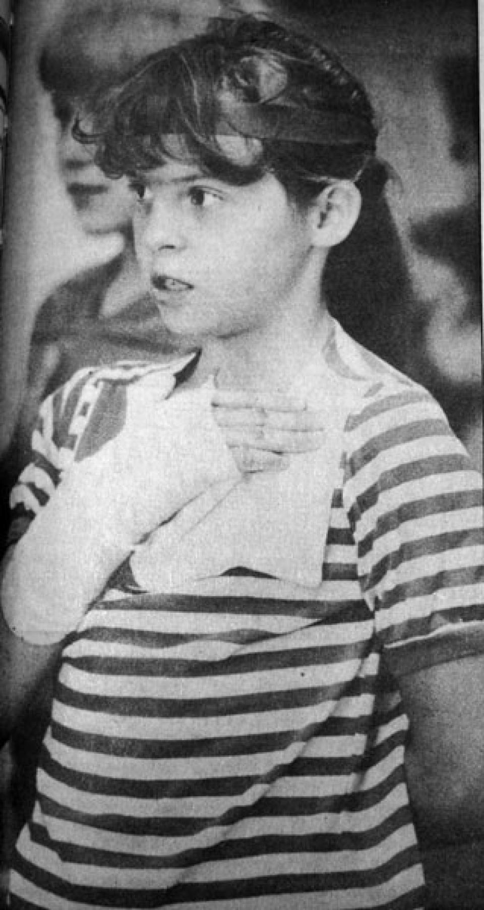 Jamie Buckley pledges allegiance to the flag the week after the Cokeville bombing. Bill Wilcox photo,  Casper Star-Tribune Collection, Casper College Western History Center.