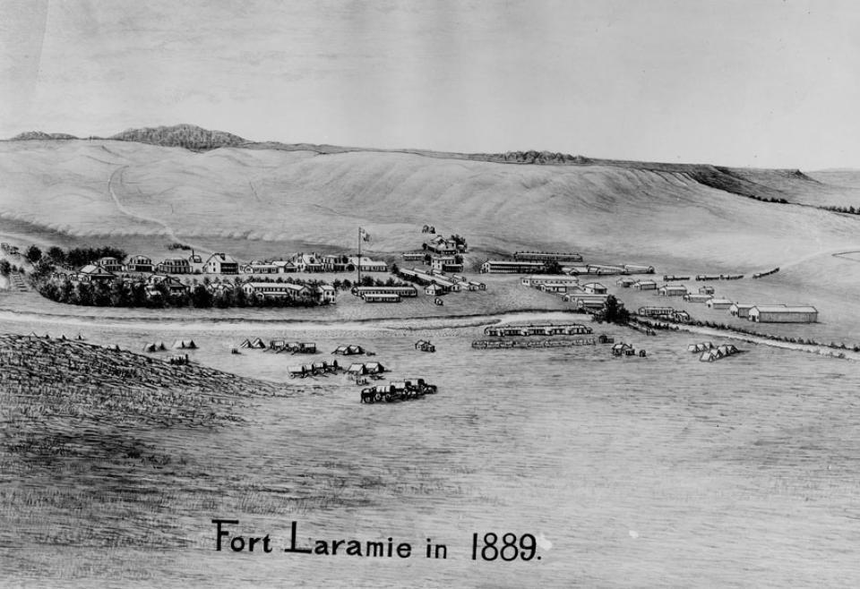 A bird's-eye view of Fort Laramie in 1889, the year before the U.S. Army closed it. The Laramie River flows between the tents and wagons in the foreground and the fort buildings in the background. American Heritage Center.