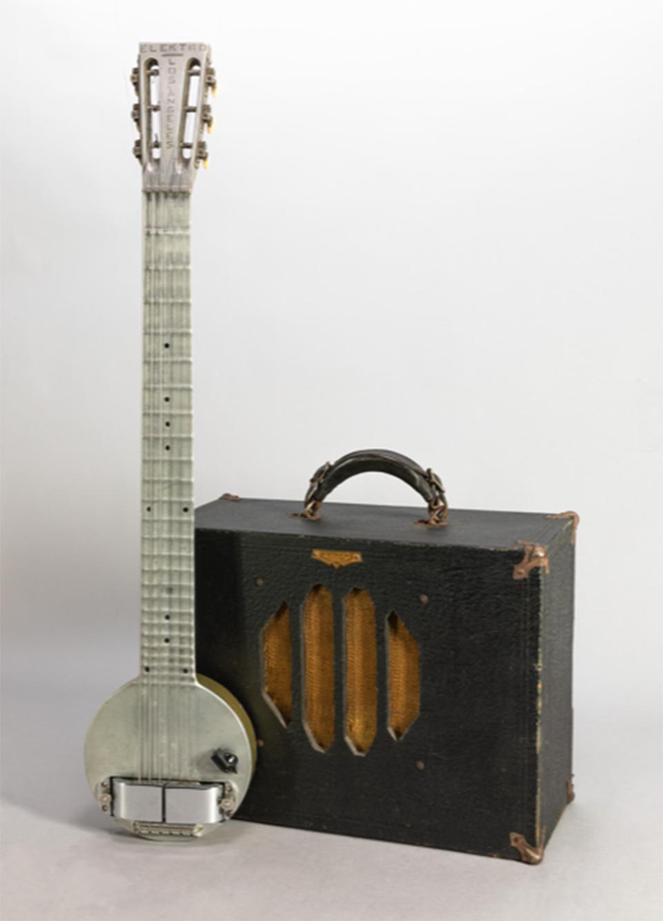 Elektro A-25 electric Hawaiian guitar and speaker unit, made in Los Angeles, 1932, by Ro-Pat-In. This was the first successful electric guitar, often called a “Frying Pan,” and a perennial favorite for playing Hawaiian music. It was also embraced by performers in big bands and country and rock and roll groups. This guitar was played on the lap. Courtesy of Lynn Wheelwright.  