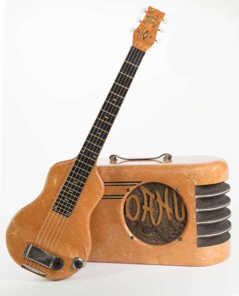 The Oahu Publishing Co. of Cleveland, Ohio, sold a variety of steel guitars to enthusiastic students also purchasing lessons and sheet music. This model is the “Troubadour” guitar with matching “Melody Master” amplifier of 1940. Courtesy of Lynn Wheelwright.