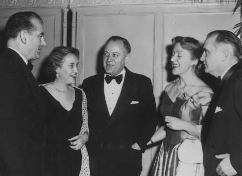 Sen. Joseph McCarthy, left, Republican of Wisconsin and his wife, Jean; Sen. Styles Bridges, center, Republican of New Hampshire and his wife, Deloris; and Sen. Herman Welker of Idaho. The three Republicans worked together to blackmail Hunt, threatening to reveal Hunt’s son’s arrest for soliciting homosexual sex if Hunt did not resign. New Hampshire Division of Archives and Records.