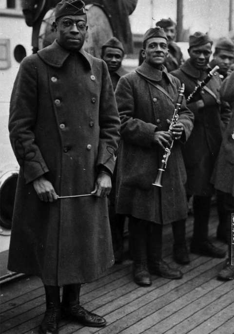 Lt. James Reese Europe, with baton, and musicians of his 369th Infantry Hellfighters Band, ca. 1918. Wyoming Veterans Memorial Museum.