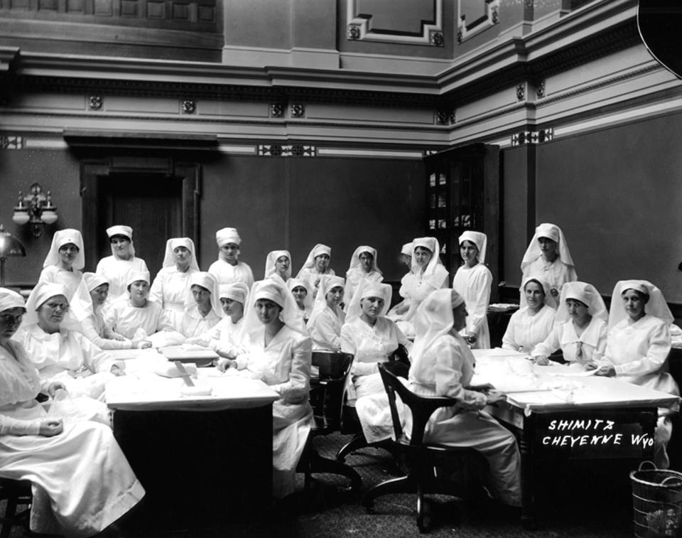 Red Cross nurses in the Senate chamber at the Wyoming Capitol in Cheyenne, ca. 1918. Joseph Schmitz photo, Wyoming State Archives. 