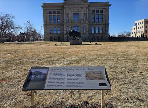 Exterior view of Capitol grounds with interpretive sign in foreground