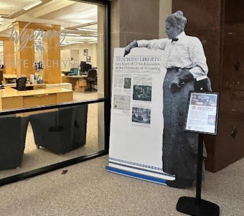 The “Teaching Liberty” exhibit at the Wyoming State Museum in Cheyenne. Poster announcement with life-size cutout of a woman