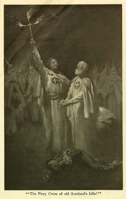 Illustration of two white men in Klan robes, the younger holding a cross in flames, with the caption "The Fiery Cross of old Scotland's hills!"