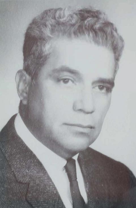 Formal portrait of Francisco “Frank” Arias as an older adult in suit and tie