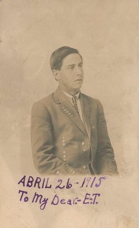 sepia portrait of serious young man in coat and tie, with handwritten, "Abril 26, 1915; to my dear EI"